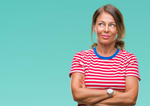 istock Middle age senior hispanic woman over isolated background smiling looking side and staring away thinking. 1043295366