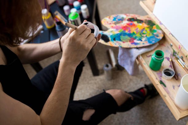 istock Artist Mixing Colors 1043299104