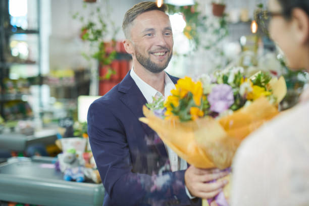 istock Man Buying Flower Bouquet 1043299776