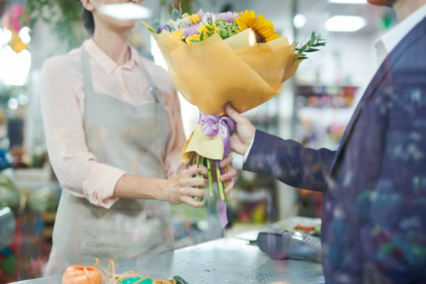 istock Man Buying Flowers 1043299784