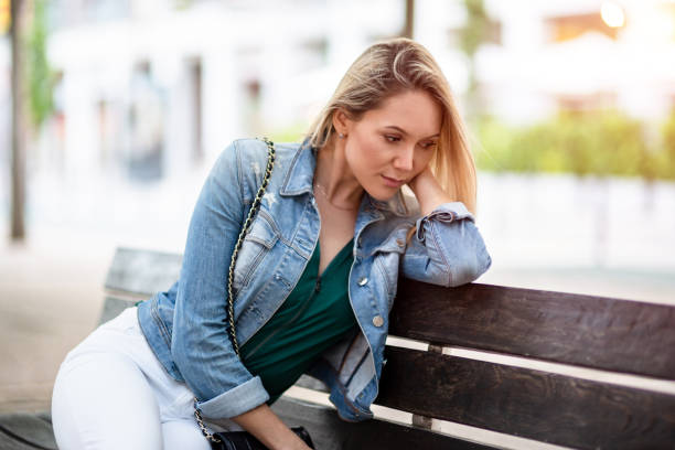 istock Sad woman on the street 1043299938