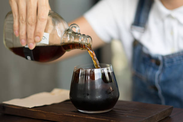 Women are pouring cold brewed coffee. stock photo