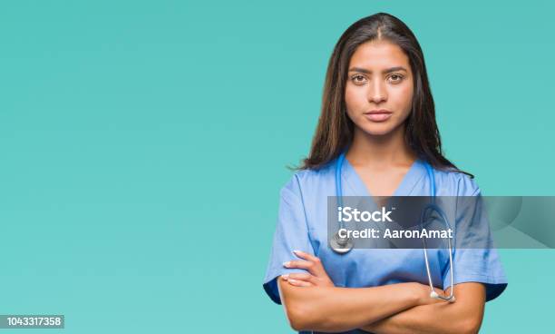 Young Arab Doctor Surgeon Woman Over Isolated Background Skeptic And Nervous Disapproving Expression On Face With Crossed Arms Negative Person Stock Photo - Download Image Now