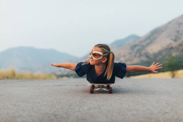 istock Young Girl Flying on Skateboard 1043320414