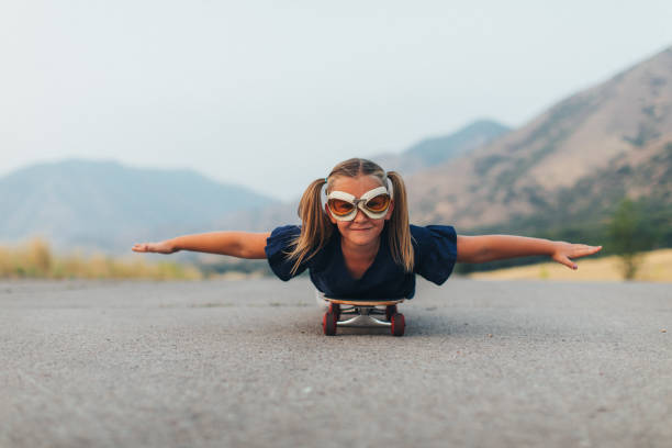 istock Young Girl Flying on Skateboard 1043320472