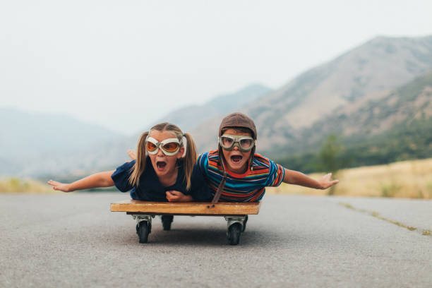 istock Young Kids Flying on a Press Cart 1043322624