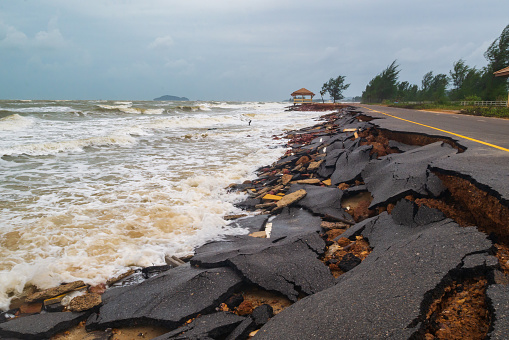 Road damage caused by sea waves erode