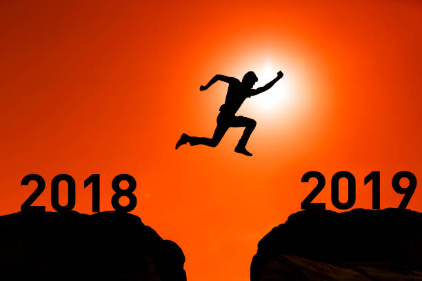 istock A man jump between 2018 and 2019 years 1043329772