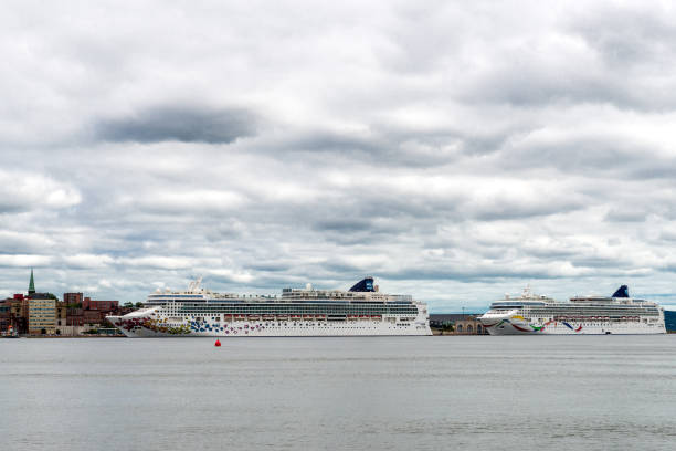 Saint John, New Brunswick, Canada - September 12, 2018: The cruise ships Norwegian Gem and Norwegian Dawn visit Saint John on a cloudy day.