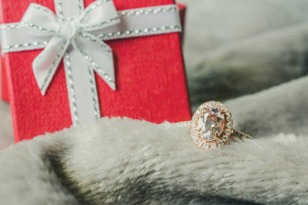 istock jewelry pink diamond ring with red gift box background 1043338248