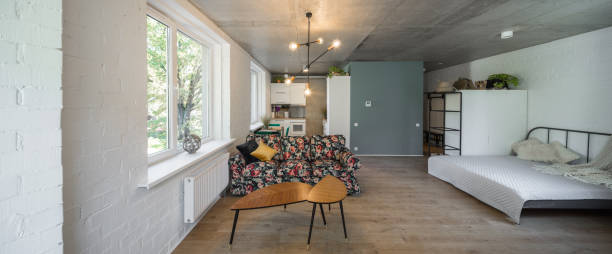 istock Bed in the apartment. Bedroom in studio apartment. 1043341504
