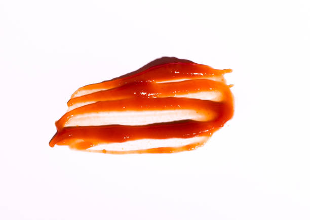 istock Tasty ketchup tomato sauce isolated over white background 1043350242