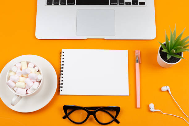 istock Laptop, plant, notepad and glasses 1043352444