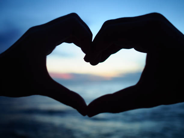 istock Hands in shape of love heart. 1043370792