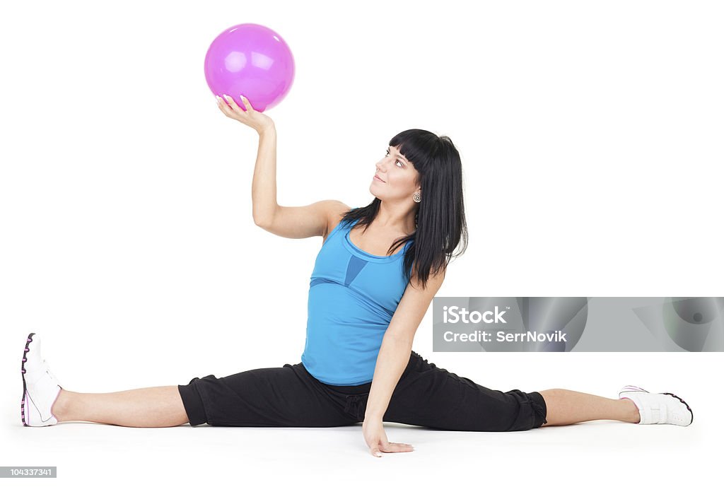 Woman exercise with ball doing splits  Active Lifestyle Stock Photo