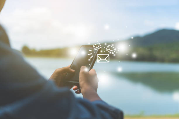 istock Woman hand using smartphone to send and recieve email. Business communication  technology concept. 1043376244