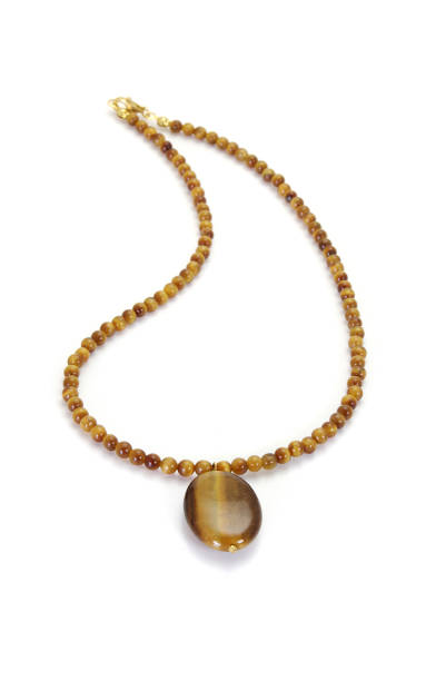 istock Tiger's eye stone necklace isolated on white 1043385864