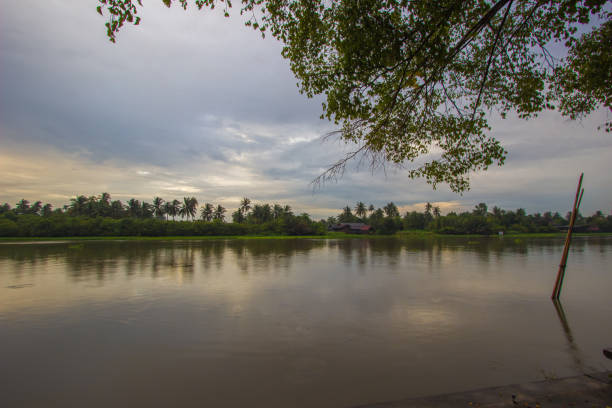 istock Overcast sky during sunset along Tha Chin river(Maenam Tha Chin),Nakhon Pathom,Thailand 1043393762