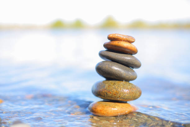 istock Stones balanced atop one another in a river 1043393844
