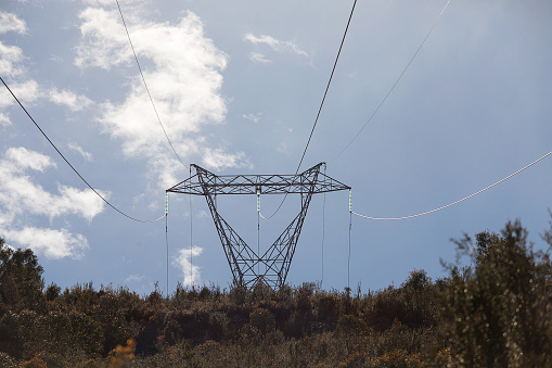 View of high voltage electricity transmission tower and lines, Tasmania