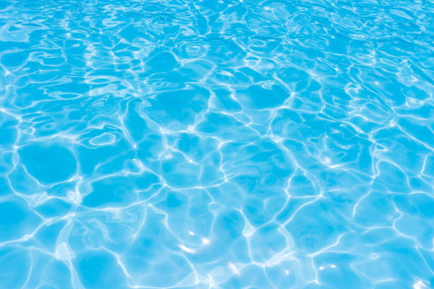 istock Light Blue swimming pool rippled water 1043408470