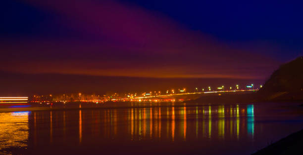 istock Blurred city lights with bokeh effect reflected on water 1043417920