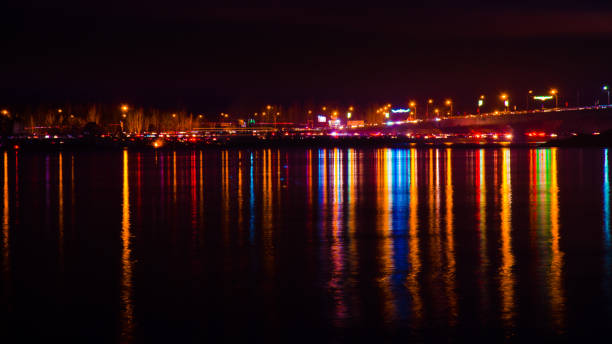 istock Blurred city lights with bokeh effect reflected on water 1043418160