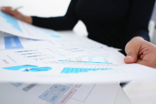 istock businesswoman study documents in office closeup 1043420950