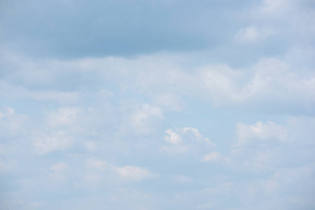 istock Beautiful white fluffy clouds on a blue sky 1043426750