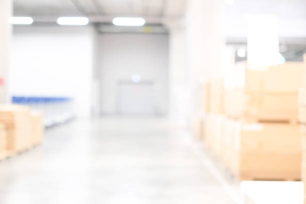 istock Blurred business background, Blur warehouse with bokeh light background 1043428988