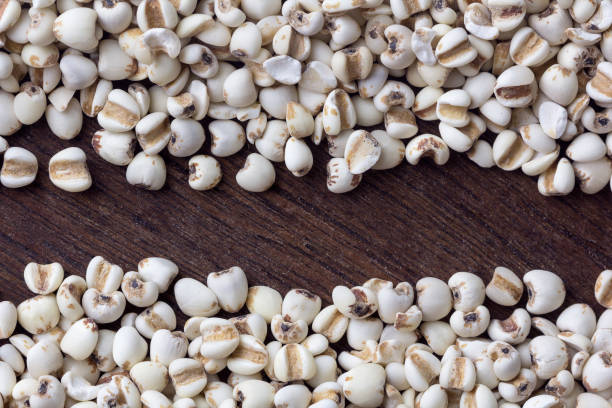 istock close up millet grain  on wooden table background. top view 1043431530