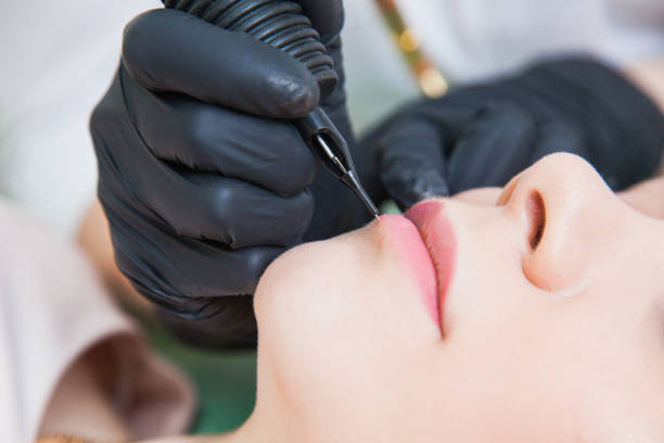 istock Beautician cosmetologist applying permanent makeup 1043431546