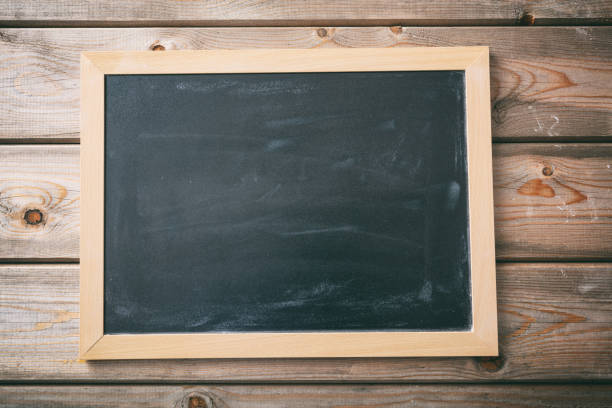 istock Blank blackboard with frame on wooden wall background 1043431752