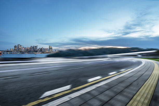 istock empty road by Sydney Harbor,Sydney 1043434410