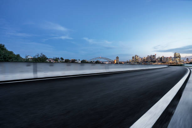 istock empty road by Sydney Harbor Bridge,Sydney 1043434466