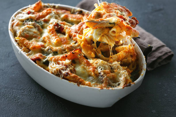 istock Baked pasta chicken ham mozzarella parmesan cheese pumpkin sauce 1043438514