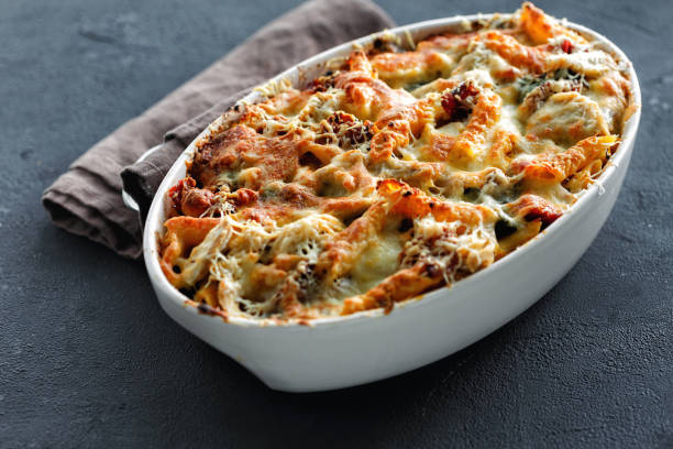 istock Baked pasta chicken ham mozzarella parmesan cheese pumpkin sauce 1043438594