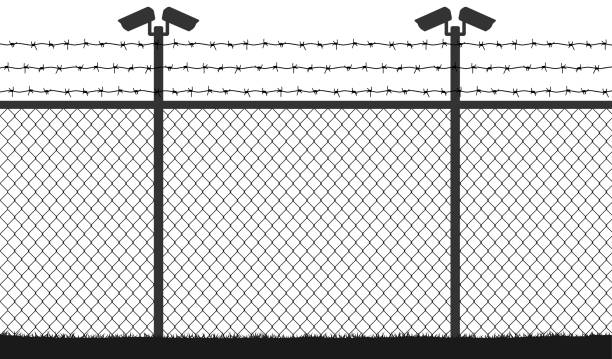 istock Fence wire mesh barbed wire, vector silhouette. Street camera on the pillar. No passage, no thoroughfare 1043443848