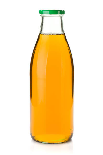 istock Apple juice in a glass bottle 1043444174