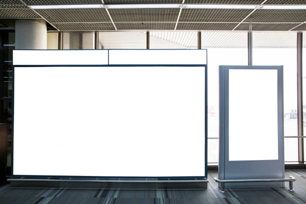 istock Blank billboard banner white mock up light box billboard at the airport with copy space for your text message or media 1043452860