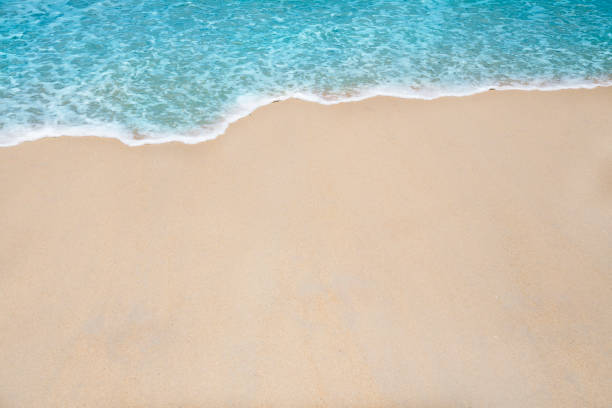 istock Soft wave and sea bubble of blue sea on sandy beach 1043453138