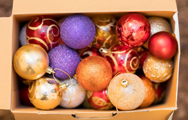 istock Colorful Christmas decorations in a cardboard box 1043456050