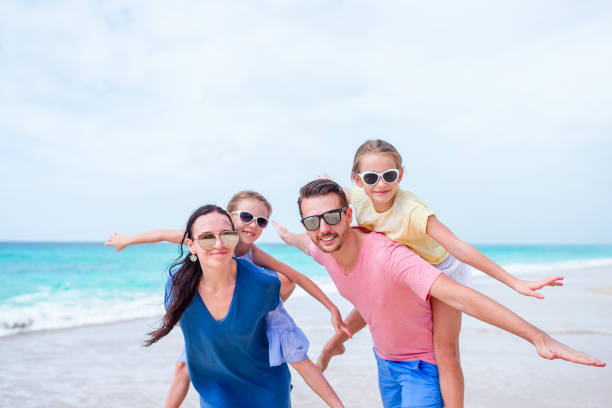 istock Happy beautiful family on the beach 1043471230