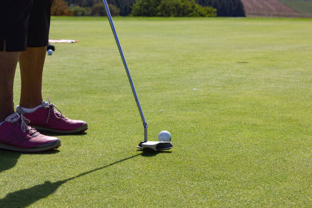 istock playing golf on summer day and green lawn 1043476426