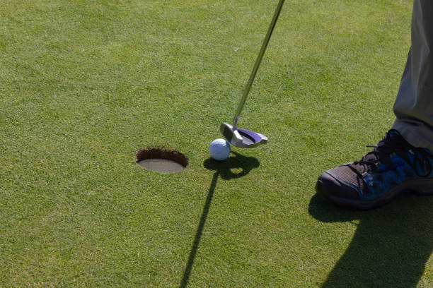 istock playing golf on summer day and green lawn 1043476718