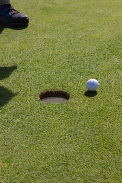 istock playing golf on summer day and green lawn 1043476730