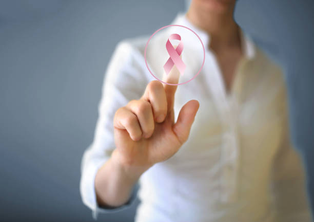 Breast cancer awareness Pink ribbon and breast cancer awareness concept on the touch screen. brest brittany stock pictures, royalty-free photos & images