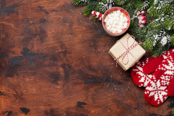 istock Christmas gift box, mittens and xmas fir tree 1043486928