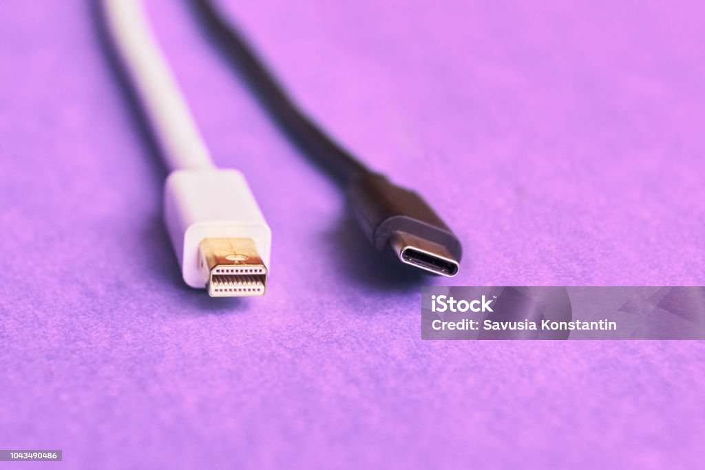 Closeup of mini display and usb type C cables. Closeup of mini display and usb type C cables on purple background Cable Stock Photo