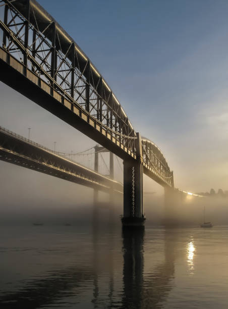 istock Sun reflecting on the Tamar Bridges in mist, Cornwall 1043491188